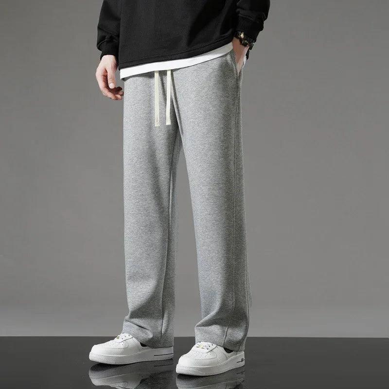 Gray drawstring sweatpants with white sneakers, styled for comfortable everyday wear