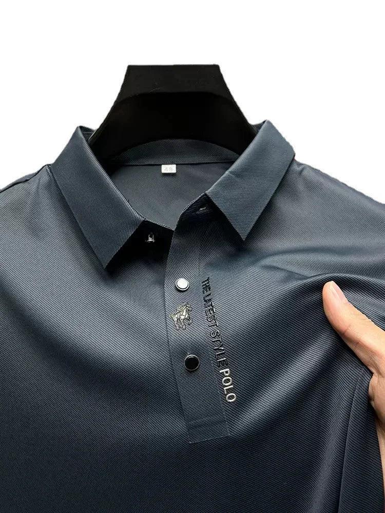 Dark gray men's polo shirt with embroidered logo and text, soft comfortable fabric for everyday wear
